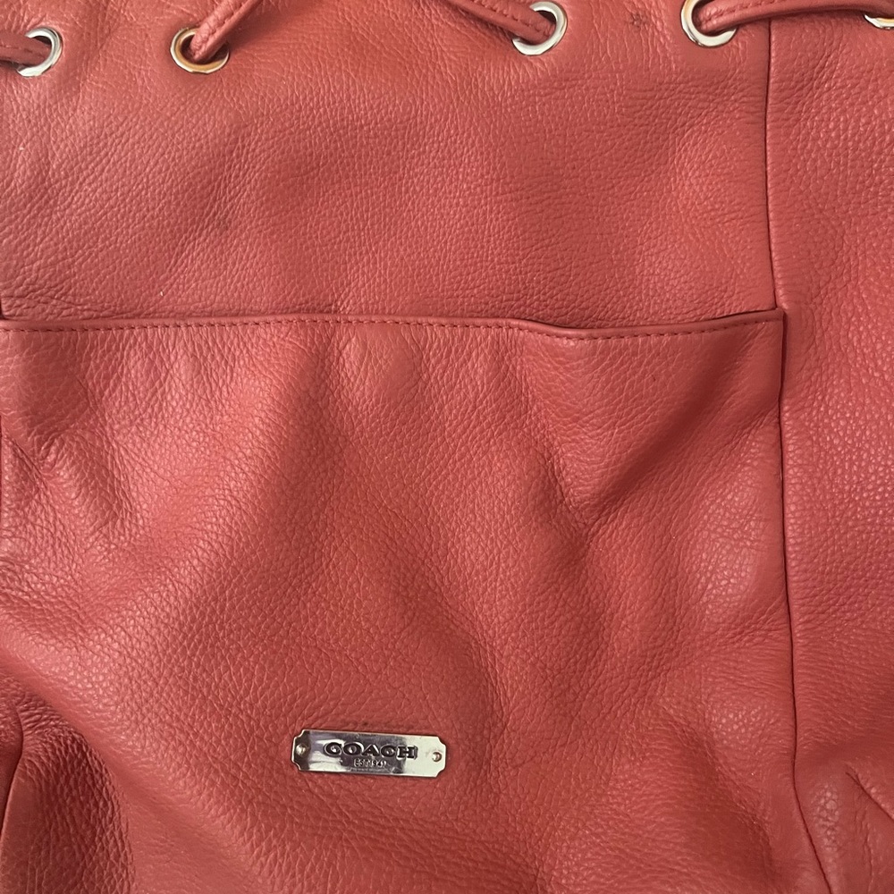 beautiful orange kate spade hobo bag